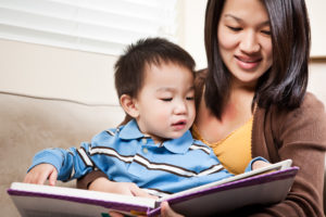 Mother and son reading a storybook together