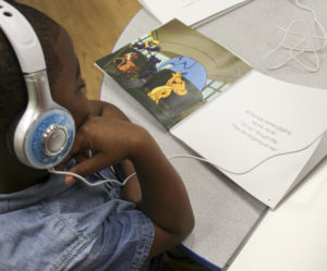 Child listening to a Storyfriends book