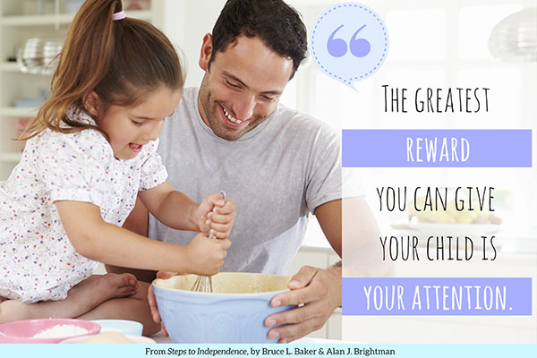 Dad and daughter whisk cake batter: The greatest reward you can give your child is your attention.
