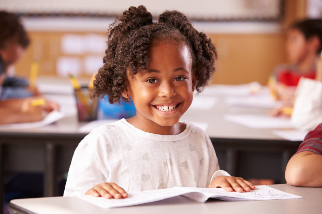 Portrait of African American elementary school girl in class - Brookes